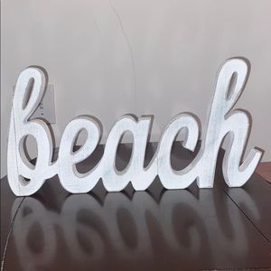 “Beach” sign